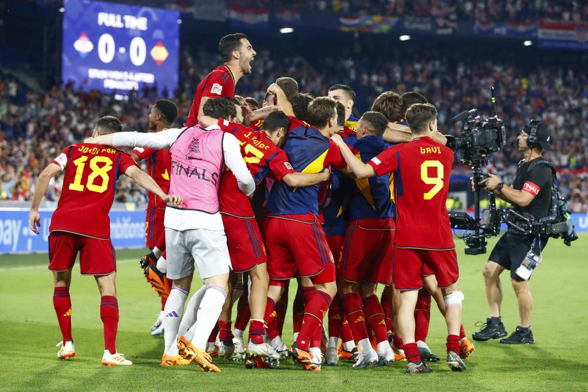 Players from the Spain national team pictured celebrating after beating Croatia in a penalty shootout to win the 2023 UEFA Nations League final
